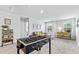 Spacious bonus room featuring a foosball table, desk area, and comfortable seating at 669 Egrets Lot 56 Lndg, Covington, GA 30014
