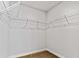 A walk-in closet with white walls and wire shelving for organized storage at 669 Egrets Lot 56 Lndg, Covington, GA 30014
