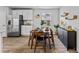 Modern dining area with stainless steel refrigerator and decorative backsplash at 669 Egrets Lot 56 Lndg, Covington, GA 30014