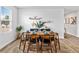 Modern dining room setting with plates, dining table, plants, and chairs at 669 Egrets Lot 56 Lndg, Covington, GA 30014