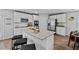 A modern kitchen with stainless steel appliances and a granite island with seating at 669 Egrets Lot 56 Lndg, Covington, GA 30014