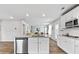 Bright kitchen featuring stainless steel appliances, granite countertops, and an island with a sink at 669 Egrets Lot 56 Lndg, Covington, GA 30014
