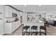 Modern kitchen featuring stainless steel appliances, granite countertops, and island seating at 669 Egrets Lot 56 Lndg, Covington, GA 30014