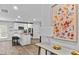 An open floor plan with an island, stainless steel appliances, and plenty of counter space at 669 Egrets Lot 56 Lndg, Covington, GA 30014