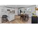 Bright eat-in kitchen featuring white cabinets, granite countertops, and stainless steel appliances at 669 Egrets Lot 56 Lndg, Covington, GA 30014