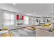 Bright and open-concept living room with wood floors, modern fireplace, and access to the kitchen at 669 Egrets Lot 56 Lndg, Covington, GA 30014