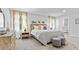 Stylish main bedroom with bedside tables, dresser, and decorative wall art at 669 Egrets Lot 56 Lndg, Covington, GA 30014