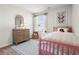 Charming bedroom featuring a pink bed frame, butterfly art and blue patterned rug at 11561 Kimberly Way # 23, Hampton, GA 30228
