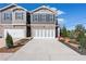 Charming new two-story townhome featuring a well-manicured yard and a spacious driveway at 11561 Kimberly Way # 23, Hampton, GA 30228