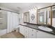 Bathroom featuring double sinks with long counter, and framed mirrors at 5141 Roswell Rd # 7, Atlanta, GA 30342