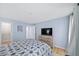 Cozy bedroom showcases hard wood floors and an adjacent walk in closet at 5141 Roswell Rd # 7, Atlanta, GA 30342