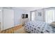 Bedroom featuring light wood floors, light blue walls and a large window at 5141 Roswell Rd # 7, Atlanta, GA 30342