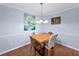 Dining room with contemporary table set and modern lighting fixture at 5141 Roswell Rd # 7, Atlanta, GA 30342
