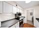 Efficient kitchen with stainless steel appliances and white cabinetry at 5141 Roswell Rd # 7, Atlanta, GA 30342