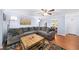 Cozy living room with hardwood floors, gray sectional and views into the dining area at 5141 Roswell Rd # 7, Atlanta, GA 30342