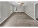 Finished basement with carpet flooring, white trim, and ample space at 6367 Deshong Dr, Lithonia, GA 30058