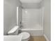 Bathroom featuring a toilet and a shower tub combination at 6367 Deshong Dr, Lithonia, GA 30058