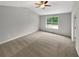 Spacious bedroom with vaulted ceiling, neutral carpet, and a bright window at 6367 Deshong Dr, Lithonia, GA 30058