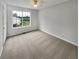 Comfortable bedroom featuring neutral carpet and a window with a view of the outdoors at 6367 Deshong Dr, Lithonia, GA 30058