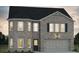 Beautiful two-story brick home with a dark roof and a two-car garage in a suburban neighborhood at 679 Egrets Landing Lot 57, Covington, GA 30014