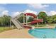 Community pool with a slide and fun water features and a slide that empties into it at 679 Egrets Landing Lot 57, Covington, GA 30014