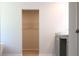 Bathroom with walk-in closet and white vessel sink on vanity at 679 Egrets Landing Lot 57, Covington, GA 30014