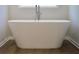 Freestanding soaking tub creating a luxurious and relaxing bath experience at 679 Egrets Landing Lot 57, Covington, GA 30014