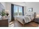 Cozy bedroom featuring wood floors, natural light, and contemporary decor at 962 Bibbs Nw Cir # 8, Atlanta, GA 30318