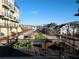 View from balcony of community green space with patio and residential buildings at 962 Bibbs Nw Cir # 8, Atlanta, GA 30318