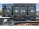 Modern apartment building showcasing gray brick, balconies, and inviting entrance, exuding contemporary urban living at 962 Bibbs Nw Cir # 8, Atlanta, GA 30318