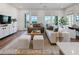 Inviting living area features hardwood floors, plush seating, and large windows for ample natural light at 962 Bibbs Nw Cir # 8, Atlanta, GA 30318