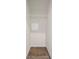 A simple but effective closet space with wood-look flooring and a wire shelf for organization at 11569 Kimberly Way # 26, Hampton, GA 30228
