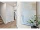 Inviting hallway featuring wood-look flooring and a glimpse of the kitchen at 11569 Kimberly Way # 26, Hampton, GA 30228