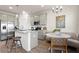 Modern kitchen features stainless steel appliances, pendant lighting, and a dining nook with bench seating at 11569 Kimberly Way # 26, Hampton, GA 30228