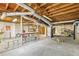 Unfinished basement with concrete floor, exposed ducts and block walls awaits your personal design and customization at 1316 Sanders Dr, Morrow, GA 30260