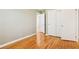 Cozy bedroom with hardwood floors, neutral paint, and closet with sliding doors at 1316 Sanders Dr, Morrow, GA 30260