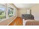 Bright living room featuring hardwood floors, a neutral paint scheme, and large windows at 1316 Sanders Dr, Morrow, GA 30260