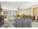 Spacious living room with stone fireplace, neutral carpeting and adjacent half bathroom at 1316 Sanders Dr, Morrow, GA 30260