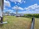 View of a large backyard with a wooden fence and other homes at 5515 Allegre Pl, Cumming, GA 30028