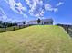 Beautiful backyard with a view, complemented by a charming black fence that frames the property at 5515 Allegre Pl, Cumming, GA 30028