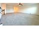 Spacious bedroom with carpet flooring and staircase at 5515 Allegre Pl, Cumming, GA 30028