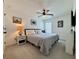 Cozy bedroom featuring a queen-size bed, neutral decor, and ceiling fan at 5515 Allegre Pl, Cumming, GA 30028
