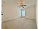 Bedroom with carpet flooring, ceiling fan and natural lighting at 5515 Allegre Pl, Cumming, GA 30028
