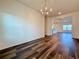 Dining room with hardwood floors, view to kitchen at 5515 Allegre Pl, Cumming, GA 30028