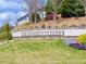 Brookview community entrance sign with a brick base surrounded by lush landscaping at 5515 Allegre Pl, Cumming, GA 30028