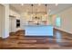 Modern kitchen with white cabinets, granite countertops and stainless steel appliances at 5515 Allegre Pl, Cumming, GA 30028