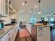 Well-lit kitchen with granite countertops, stainless steel appliances, and a stylish island at 5515 Allegre Pl, Cumming, GA 30028