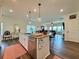 Spacious kitchen with a large island, stainless steel appliances, and an open layout to the dining area at 5515 Allegre Pl, Cumming, GA 30028