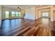 Open concept living room with hardwood floors and lots of natural light at 5515 Allegre Pl, Cumming, GA 30028