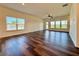 Spacious living room with hardwood floors and natural light at 5515 Allegre Pl, Cumming, GA 30028